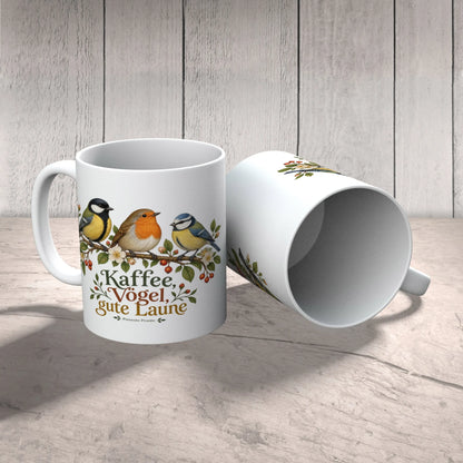 Fröhliche Tasse mit Vögeln für Vogelliebhaber auf blühendem Zweig|p:2016859|h:fac5e2250e48ea1c7c21a139041a17b5
