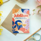 Fröhliche Glückwunschkarte zum Jubiläum mit Sternenstrahlen|p:2017278|h:f48b3993b50e6e3816467f708cda9fd4