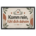 Herzliche Fußmatte für Zuhause mit Haus in Terrakotta