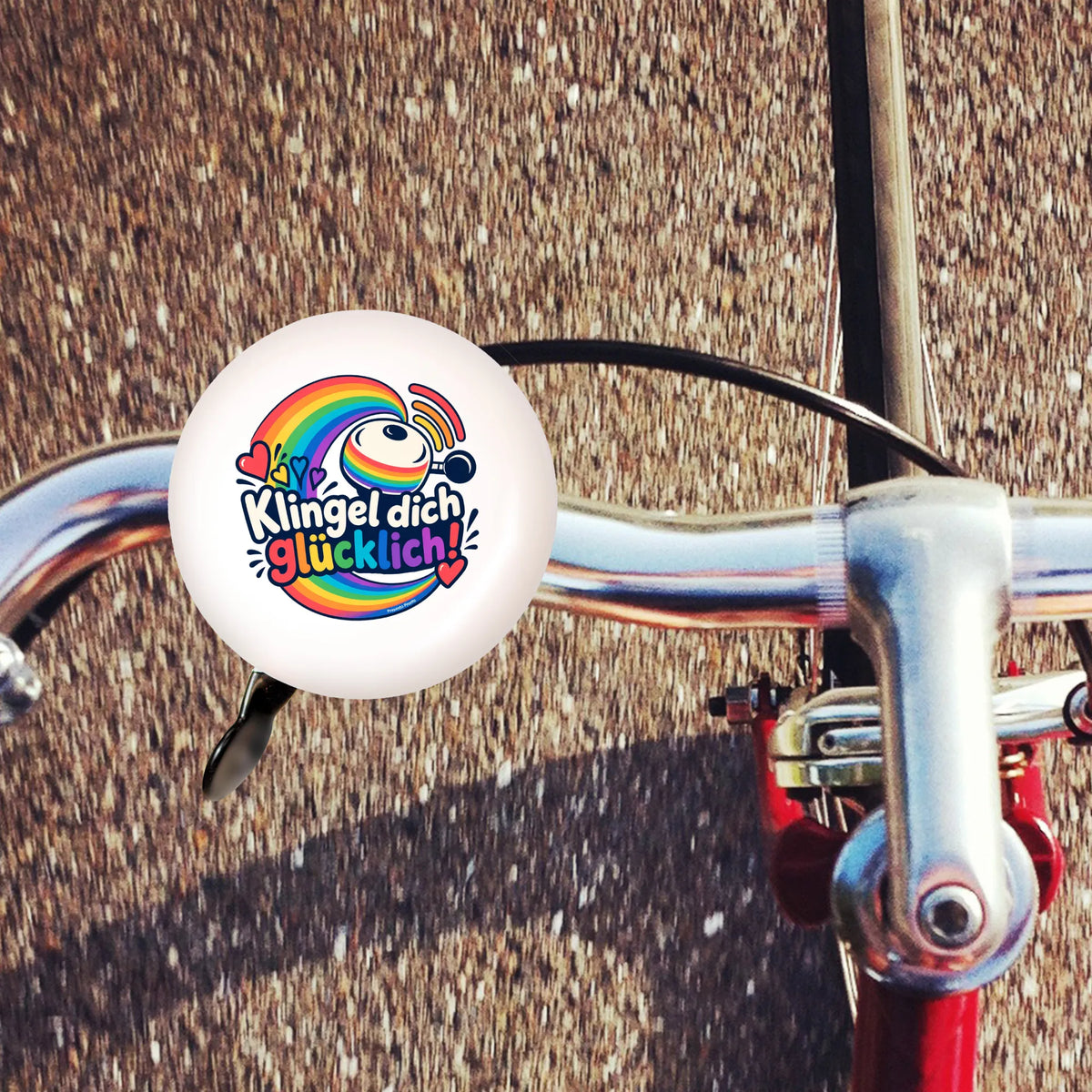 Fröhliche Fahrradklingel mit Regenbogen für Kinder