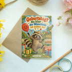 Lustige Geburtstagskarte mit tanzendem Waschbär|p:2021420|h:5726a88d54ccb17e889f1a3094529b88