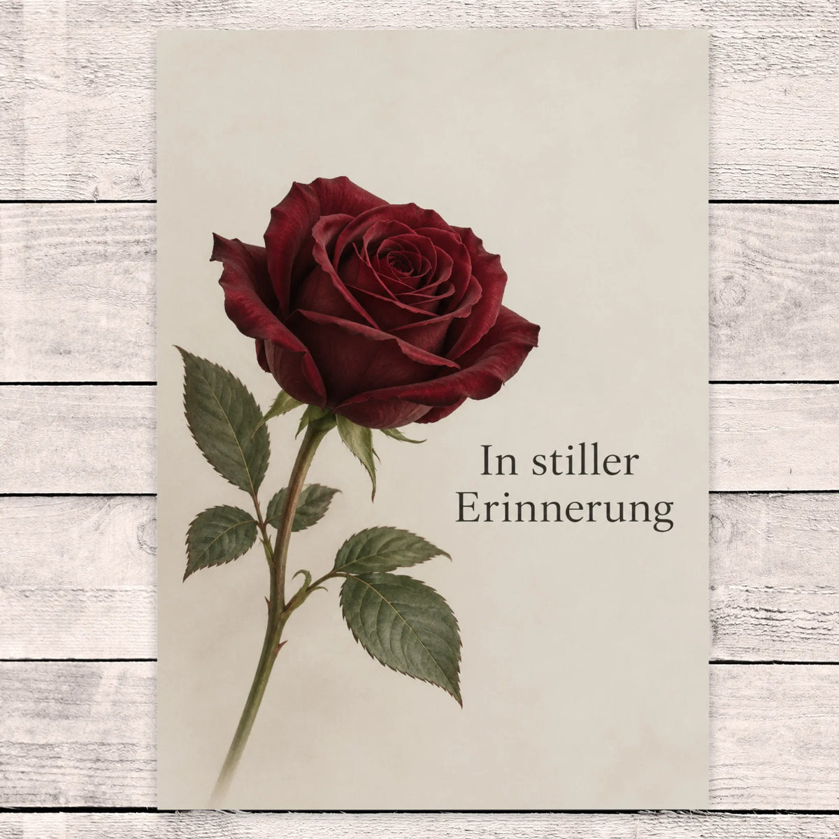 Würdevolle Trauerkarte mit burgunderroter Rose