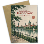 Herzliche Urlaubskarte aus Hannover mit Fahrrädern am Fluss|p:2023355|h:0de2687e4d480f6434743195519d12d7